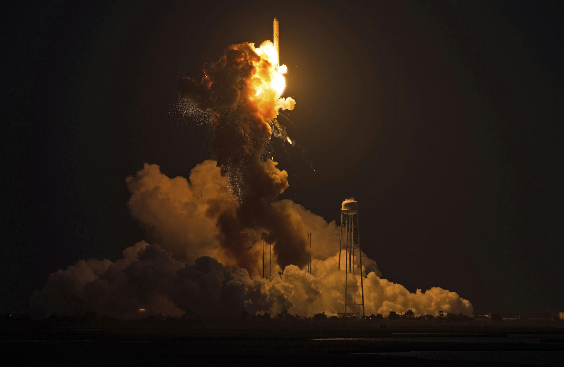 This image provided by NASA shows the Orbital Sciences Corporation Antares rocket, with the Cygnus spacecraft onboard suffers a catastrophic anomaly moments after launch from the Mid-Atlantic Regional Spaceport Pad 0A, Tuesday, Oct. 28, 2014, at NASA's Wallops Flight Facility in Virginia. The Cygnus spacecraft was filled with about 5,000 pounds of supplies slated for the International Space Station, including science experiments, experiment hardware, spare parts, and crew provisions. (AP Photo/N