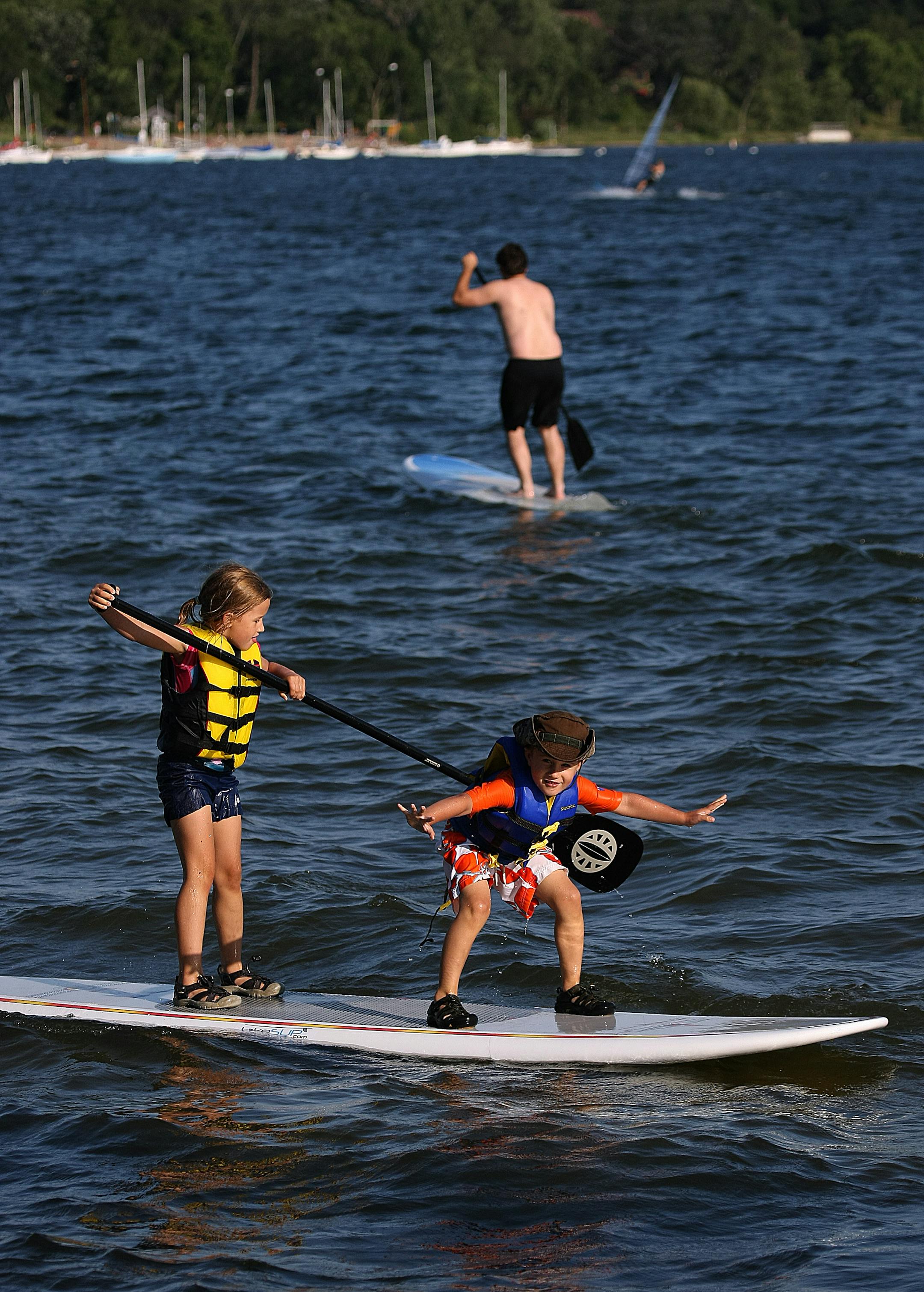 McKayla Krolczyk, 7, and her brother, Leo, 5, took to the water with ease as they demonstrated stand-up paddling recently on Lake Calhoun in Minneapolis