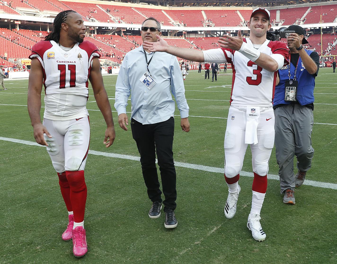 Arizona Cardinals wide receiver Larry Fitzgerald (11) and quarterback Josh Rosen (3) walk off the field after an NFL football game against the San Francisco 49ers in Santa Clara, Calif., Sunday, Oct. 7, 2018. (AP Photo/Tony Avelar) ORG XMIT: FXN