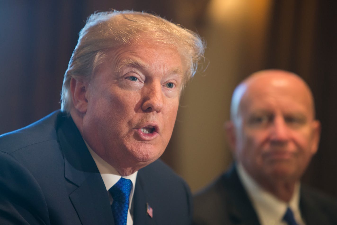 President Donald Trump talks about the Republican tax plan alongside Rep. Kevin Brady (R-Texas), chairman of the House Ways and Means Committee, inside the Cabinet Room at the White House in Washington, Nov. 2, 2017.