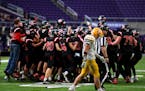 Mayer Lutheran celebrates their victory in the Class 1A state championship football game between Minneota and Mayer Lutheran Friday, Nov. 26, 2021 at 