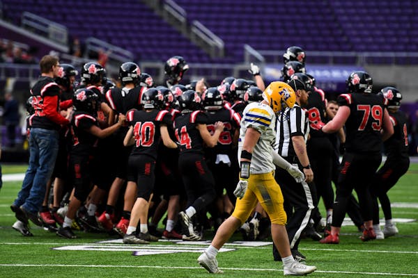 Mayer Lutheran celebrates their victory in the Class 1A state championship football game between Minneota and Mayer Lutheran Friday, Nov. 26, 2021 at 