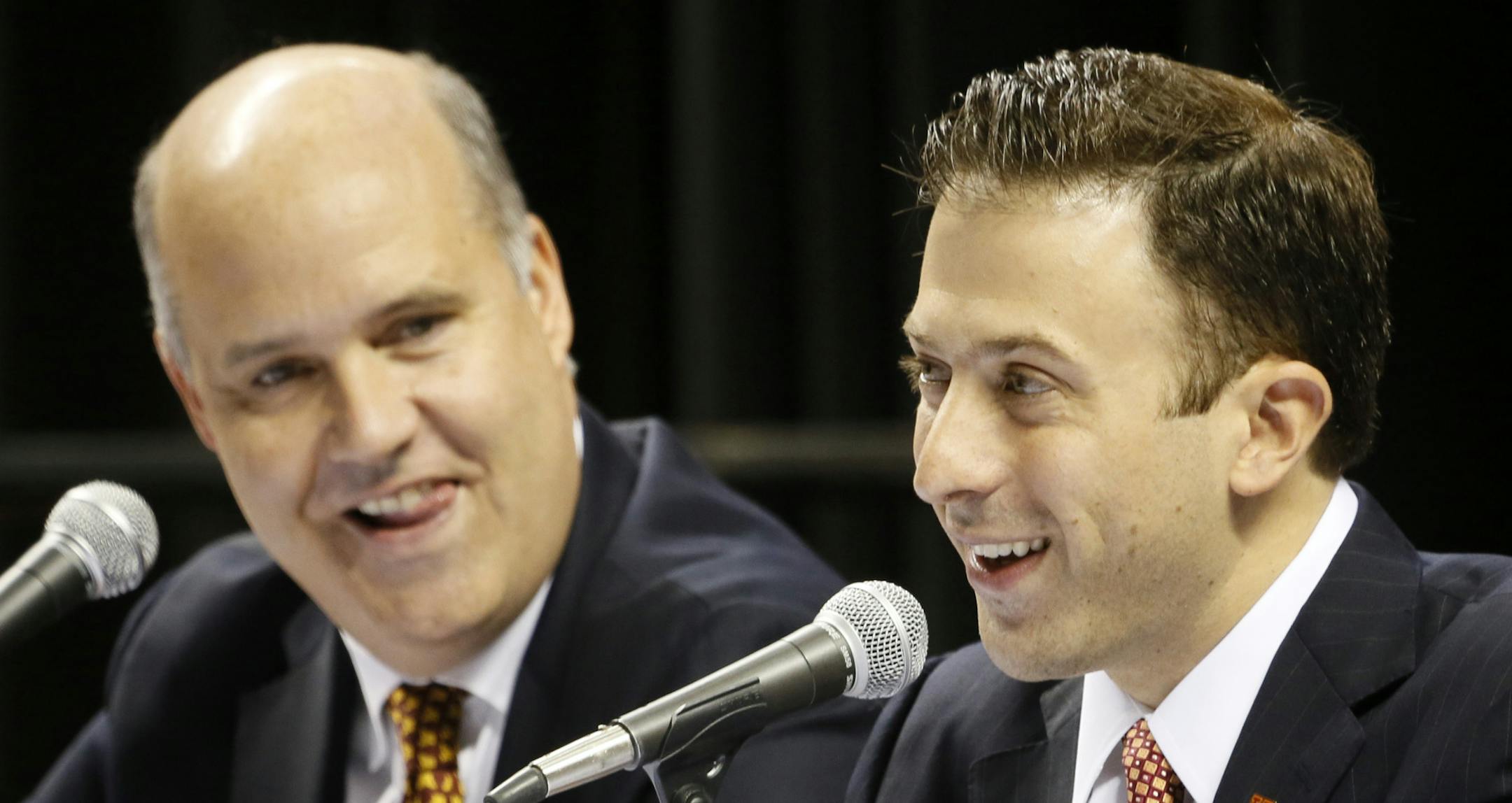 Minnesota Athletic Director Norwood Teague , left, and basketball coach Richard Pitino