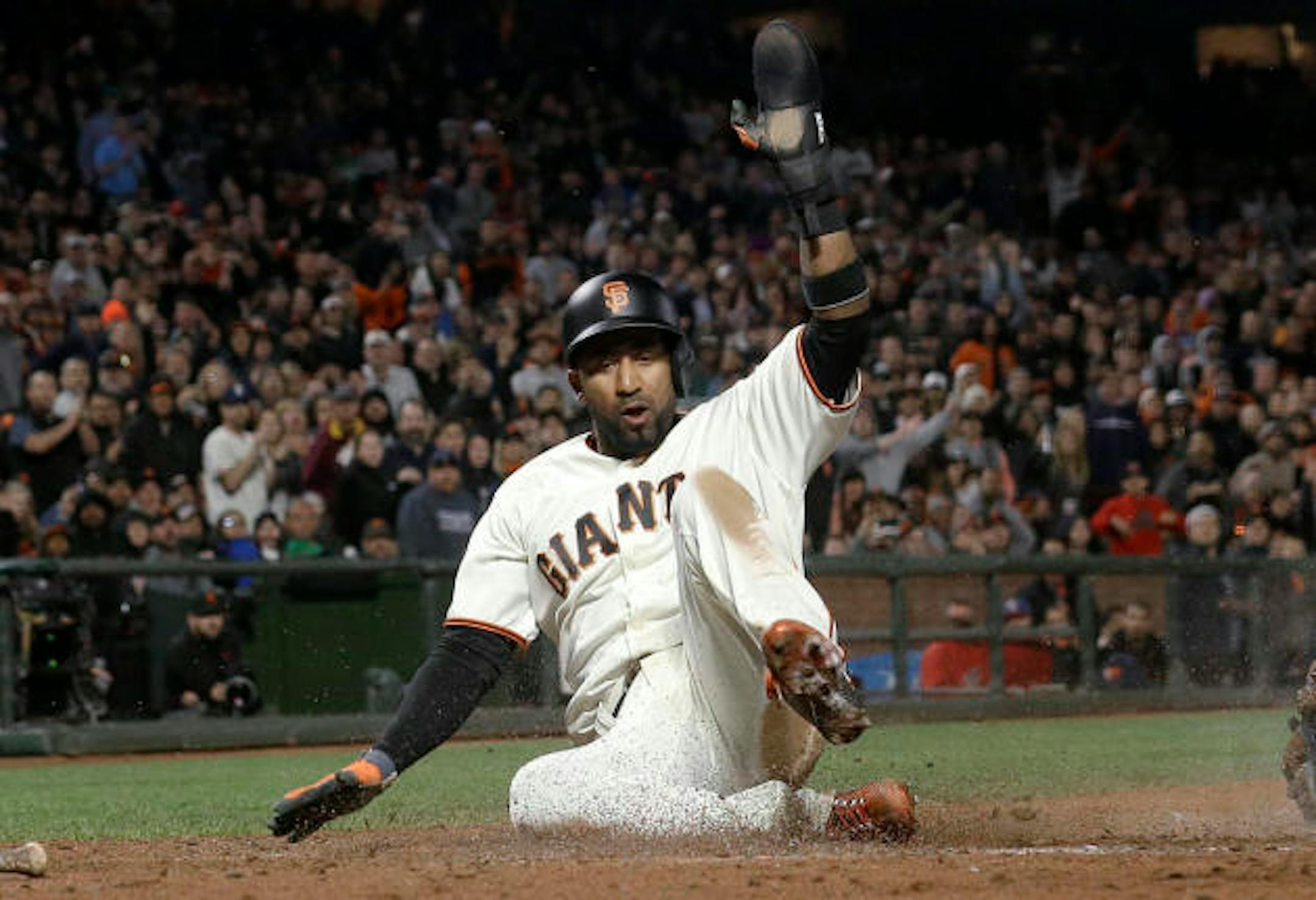 San Francisco Giants' Eduardo Nunez scores against the Cleveland Indians during the sixth inning of a baseball game in San Francisco, Tuesday, July 18, 2017. (AP Photo/Jeff Chiu)