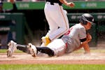The Twins' Max Kepler scores on what was ruled a first-inning passed ball by Pirates catcher Henry Davis — even though the ball clearly hit Byron Bu