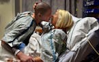 "Thank you," says Kasey Bergh as she kisses her husband Henry Glendening goodbye in the preoperative area before he donates a kidney to her at Barnes-