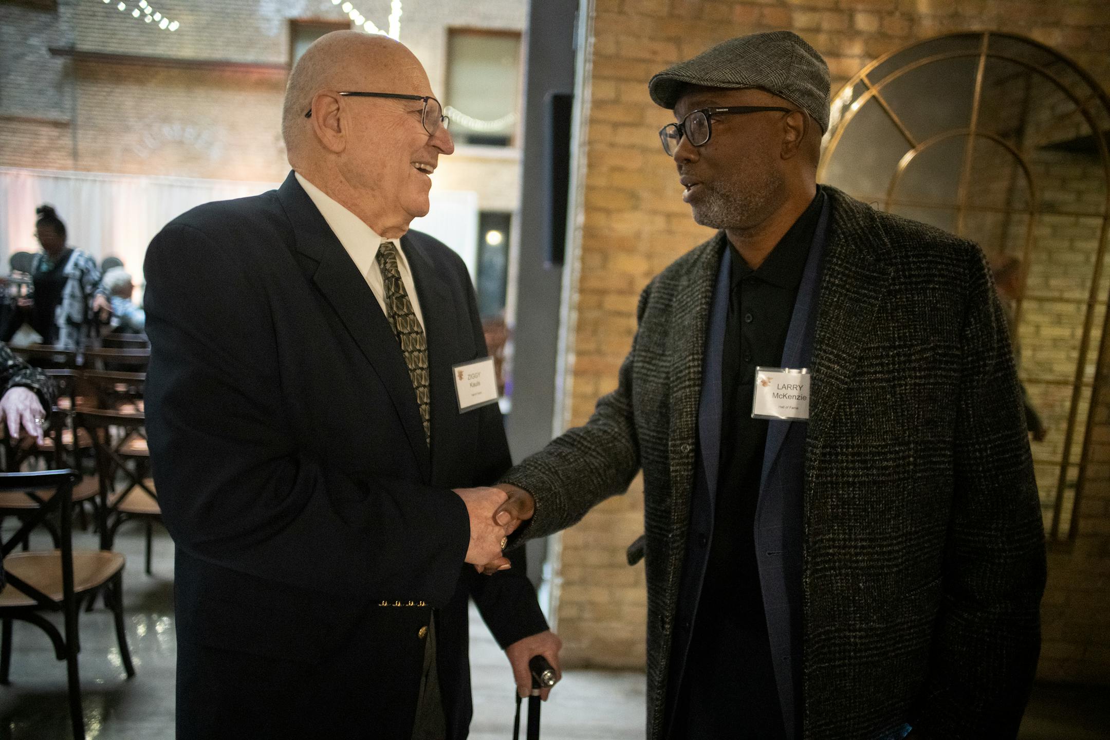 Coach Ziggy Kauls who led Mounds View to 12 state tournaments, winning titles in 1972 and 1999 greets coach Larry McKenzie, who was the first coach to win 4 straight state championships, greet each other before they are both inducted into the Minn. H.S. Basketball Hall of Fame in Minneapolis, Minn., on Thursday, April 7, 2022. Fifteen people will be inducted into the Minnesota High School Basketball Hall of Fame ] RICHARD TSONG-TAATARII • richard.tsong-taatarii@startribune.com