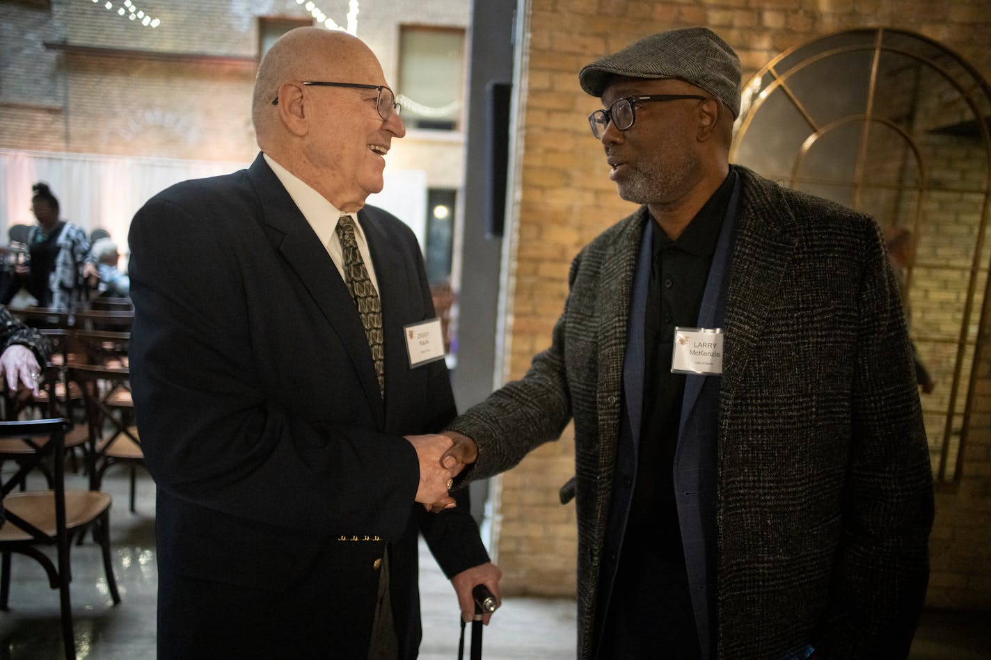 Coach Ziggy Kauls who led Mounds View to 12 state tournaments, winning titles in 1972 and 1999 greets coach Larry McKenzie, who was the first coach to win 4 straight state championships, greet each other before they are both inducted into the Minn. H.S. Basketball Hall of Fame in Minneapolis, Minn., on Thursday, April 7, 2022. Fifteen people will be inducted into the Minnesota High School Basketball Hall of Fame ] RICHARD TSONG-TAATARII • richard.tsong-taatarii@startribune.com