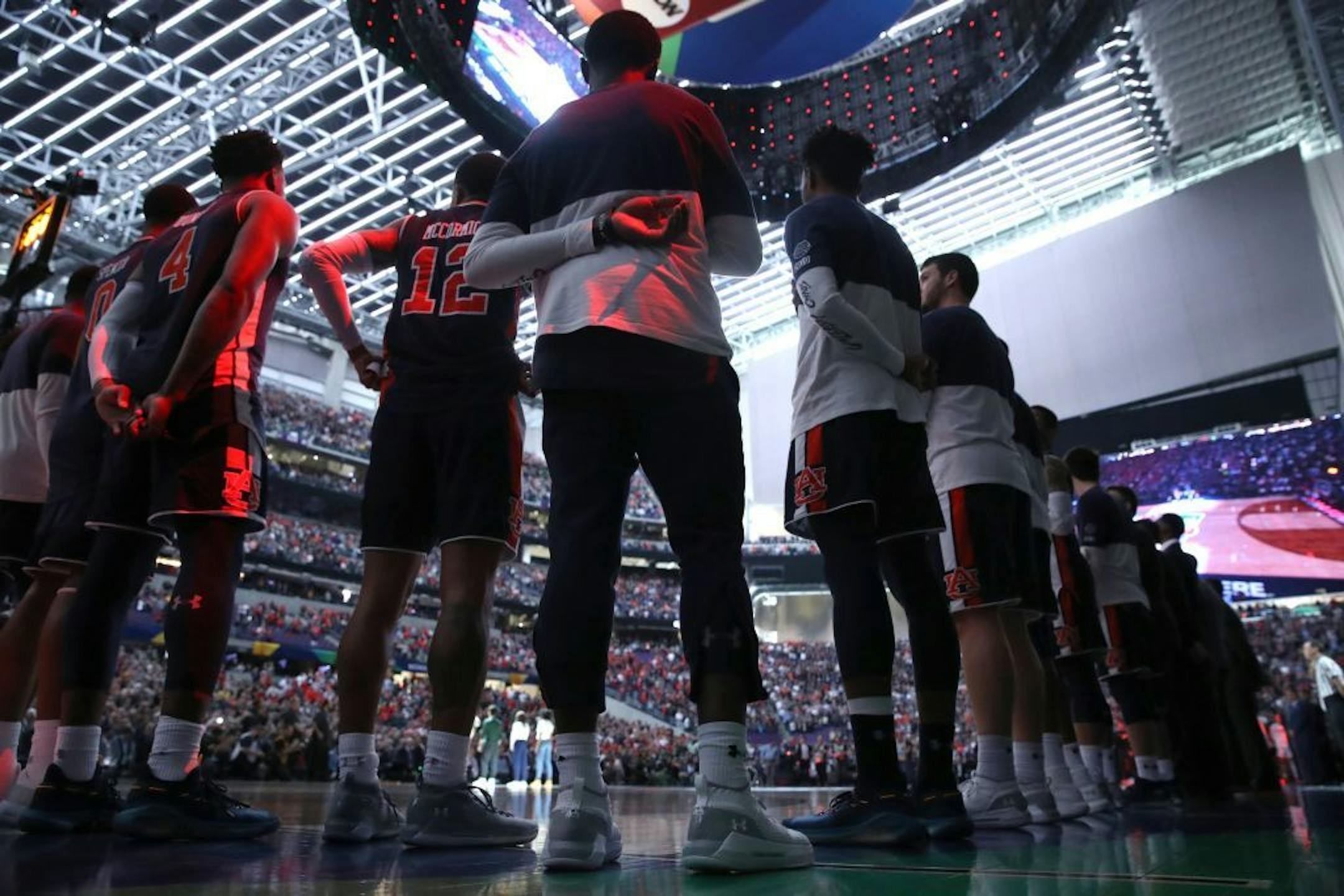 Auburn guard Jared Harper (1) stood with teammates during the National Anthem.