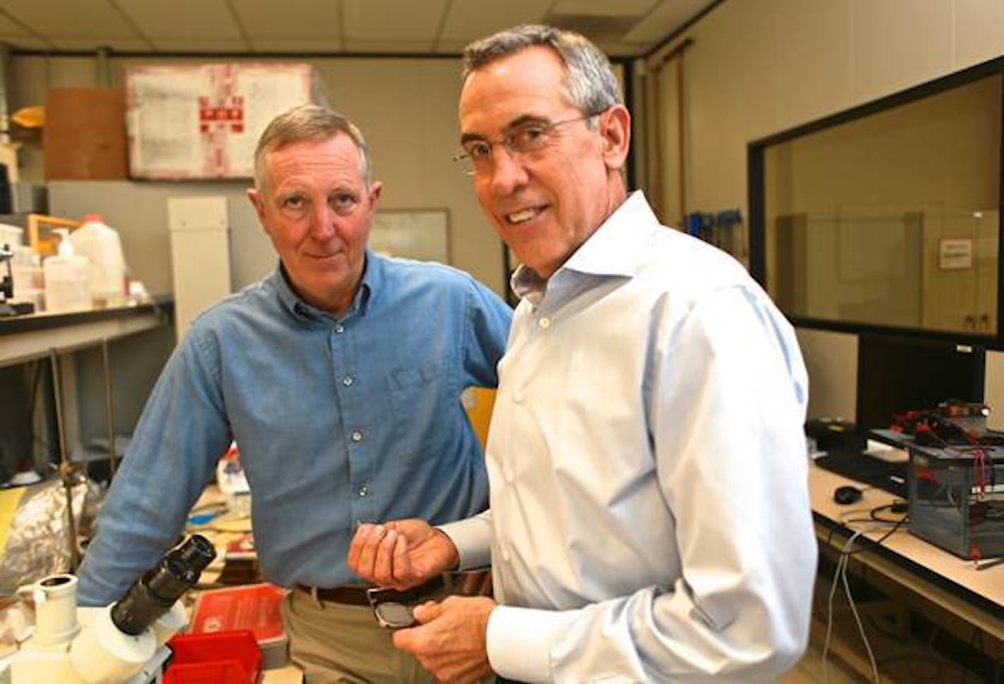 Rick Riley, co-founder & COO, (left) and Allan Will, chairman and CEO, in the EBR Systems lab. Allan Will has transmitter components in his hands. Mandatory credit: Abe Rodriguez