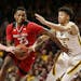 Rutgers guard Montez Mathis drives on Minnesota guard Amir Coffey during the second half Saturday in Minneapolis. The Gophers defeated Rutgers 88-70.