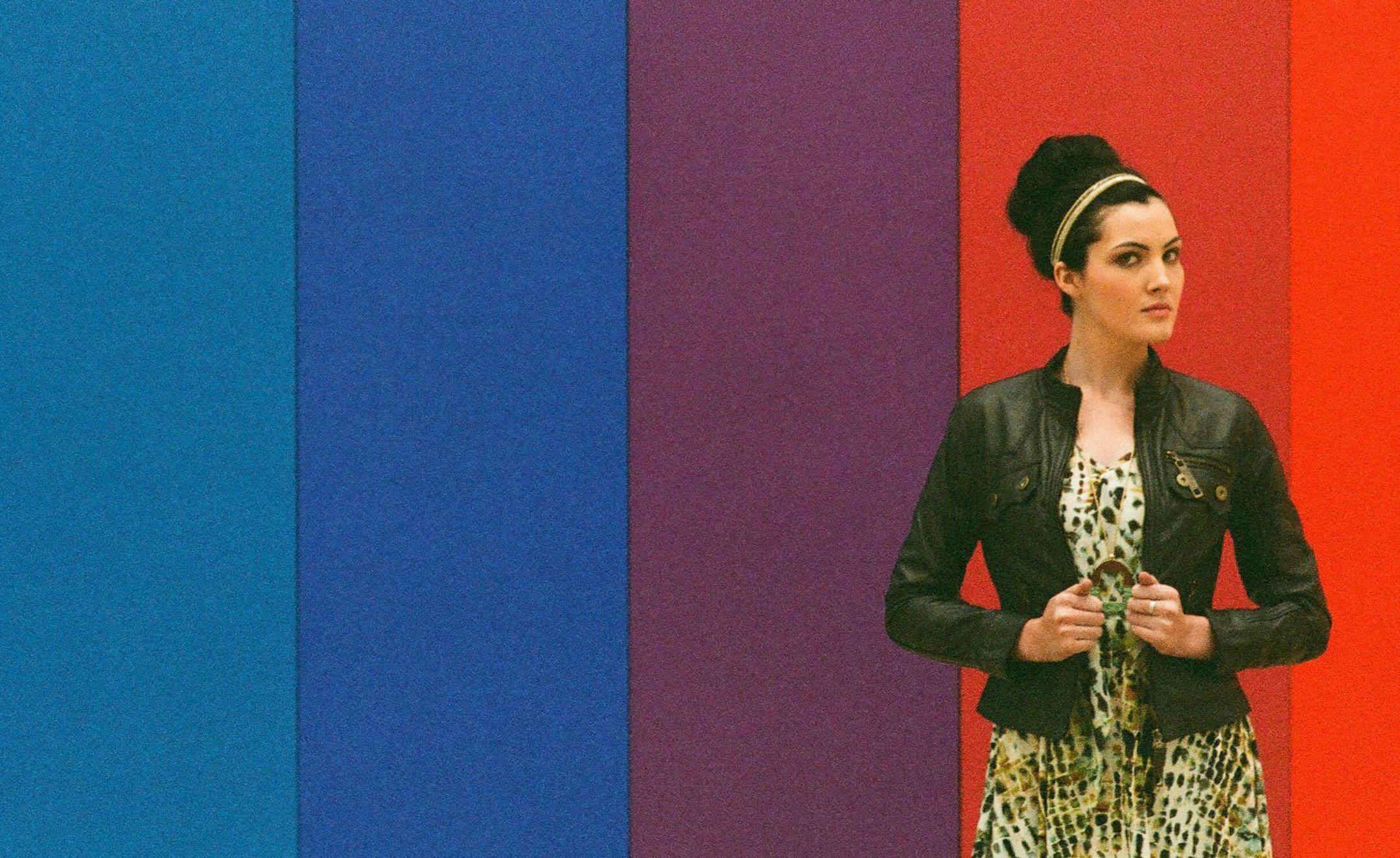 Molly stands in front of 'Spectrum II,' 1966-67, by Ellsworth Kelly. She models Simply Vera by Vera Wang's Crocodile dress ($40.60) at Kohl's, www.kohls.com; wood and teal pendant necklace ($12) and brown faux leather jacket from Brave Soul ($48), both at Glik's, www.gliks.com; Deepa Gurnani headband ($45) at Ivy Hill, www.ivyhillboutique.com. (Erik M. Lunsford/St. Louis Post-Dispatch/MCT) ORG XMIT: 1143577