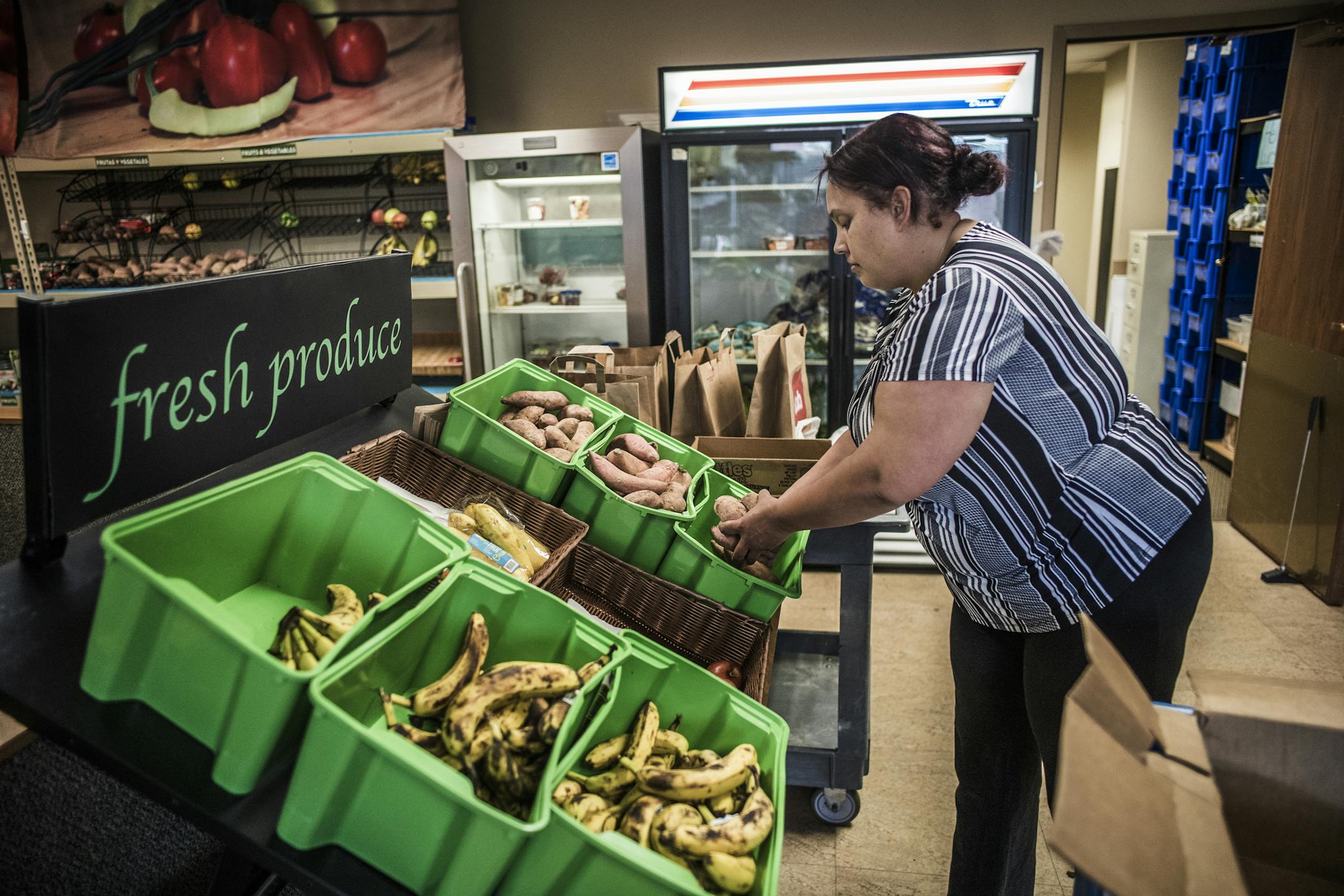At 360 Communities Food Shelf in Burnsville, Sophia Bond stocks the produce bins with yams. ]Minnesotans visited food shelves 3.4 million times in 2017 --the highest number of visits in recorded history, according to data from the Minnesota Department of Human Services that was analyzed by Hunger Solutions.Richard Tsong-Taatarii&#xef;rtsong-taatarii@startribune.com