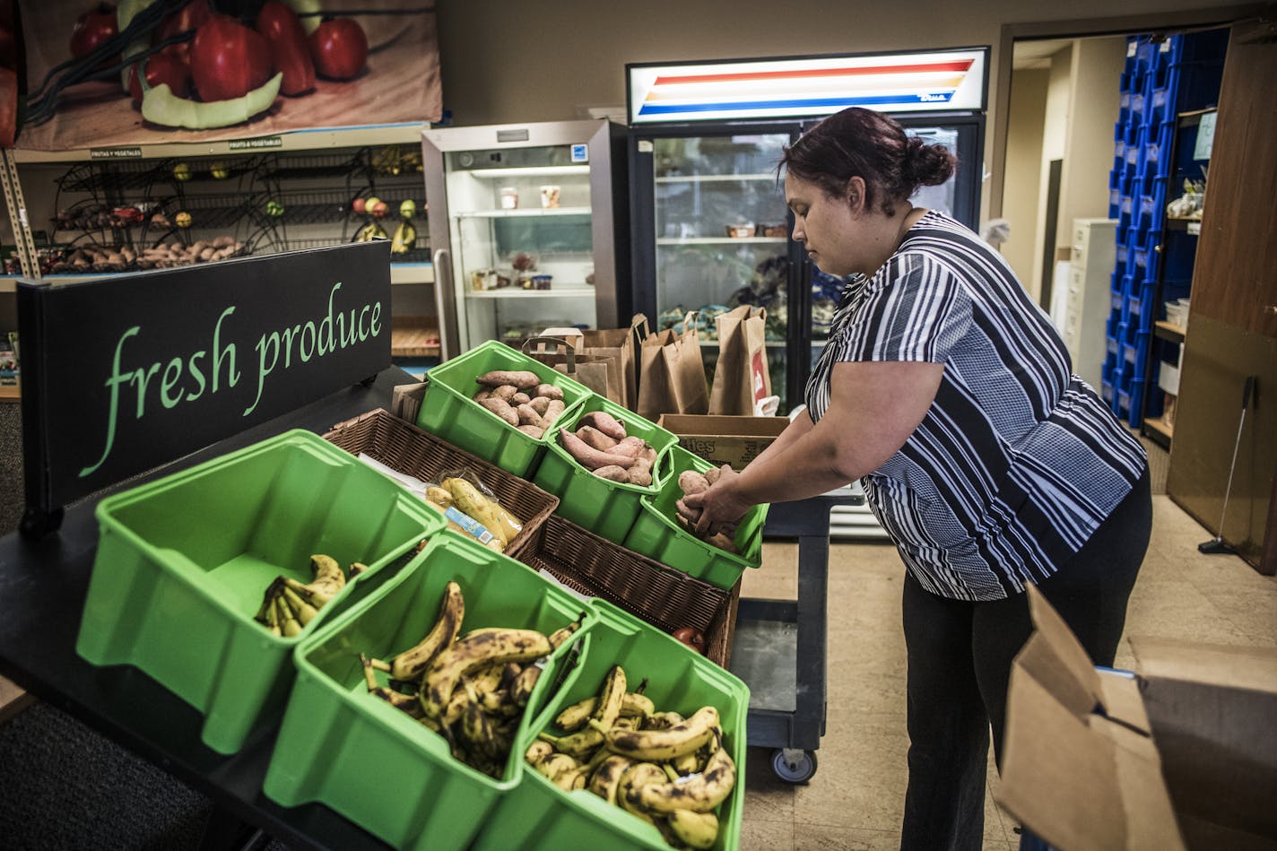 At 360 Communities Food Shelf in Burnsville, Sophia Bond stocks the produce bins with yams. ]Minnesotans visited food shelves 3.4 million times in 2017 --the highest number of visits in recorded history, according to data from the Minnesota Department of Human Services that was analyzed by Hunger Solutions.Richard Tsong-Taatarii&#xef;rtsong-taatarii@startribune.com