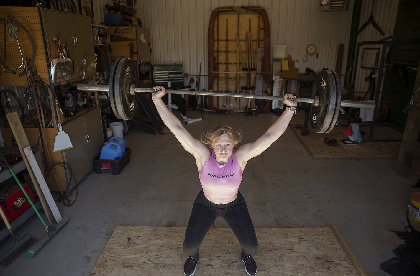 Olympic shot putter Maggie Ewen practiced and worked out at her family's farm, Thursday, April 30, 2020 in St. Francis, MN. Ewen has trained for several years in Arizona because she went to Arizona State, but has moved back home to her parents&#x2019; farm. They have a gym set up in the barn and plenty of open space to throw. She said it&#x2019;s like turning back the clock to high school. ] ELIZABETH FLORES &#x2022; liz.flores@startribune.com