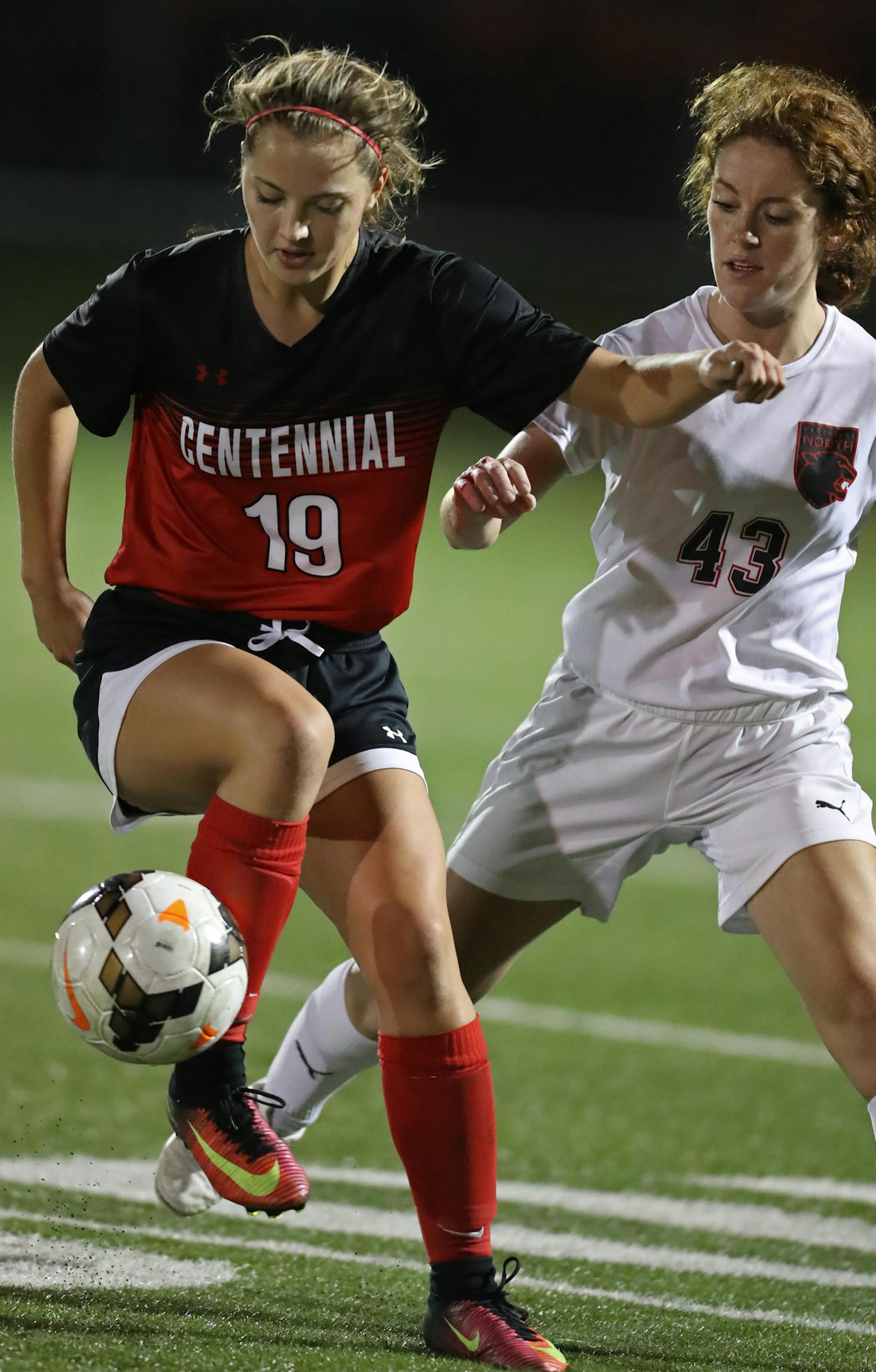 Ashley Ebeling(19) and Anna Larson(43) of Lakeville North battle for the ball. ]In a Quarterfinal game class 2A girls' soccer game between Centennial and Lakeville North.Richard Tsong-Taatarii/rtsong-taatarii@startribune.com