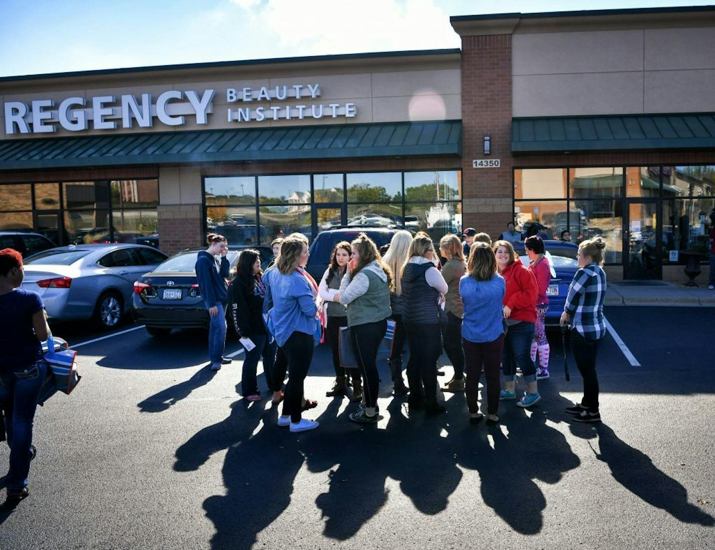 Regency Beauty Institute students gathered outside the Burnsville school to pick up their personal items. The school is closing all 79 of its schools nationwide, including several in the Twin Cities area.