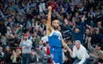 Minnesota Timberwolves guard Jordan McLaughlin (6) holds the follow through after hitting a three pointer against the Cleveland Cavaliers in the first