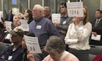 Angry residents of Forest Lake held up placards and some yelled, "Shame on you!" after city councilors voted to reject a psychiatric residential facil