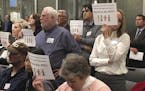 Angry residents of Forest Lake held up placards and some yelled, "Shame on you!" after city councilors voted to reject a psychiatric residential facil