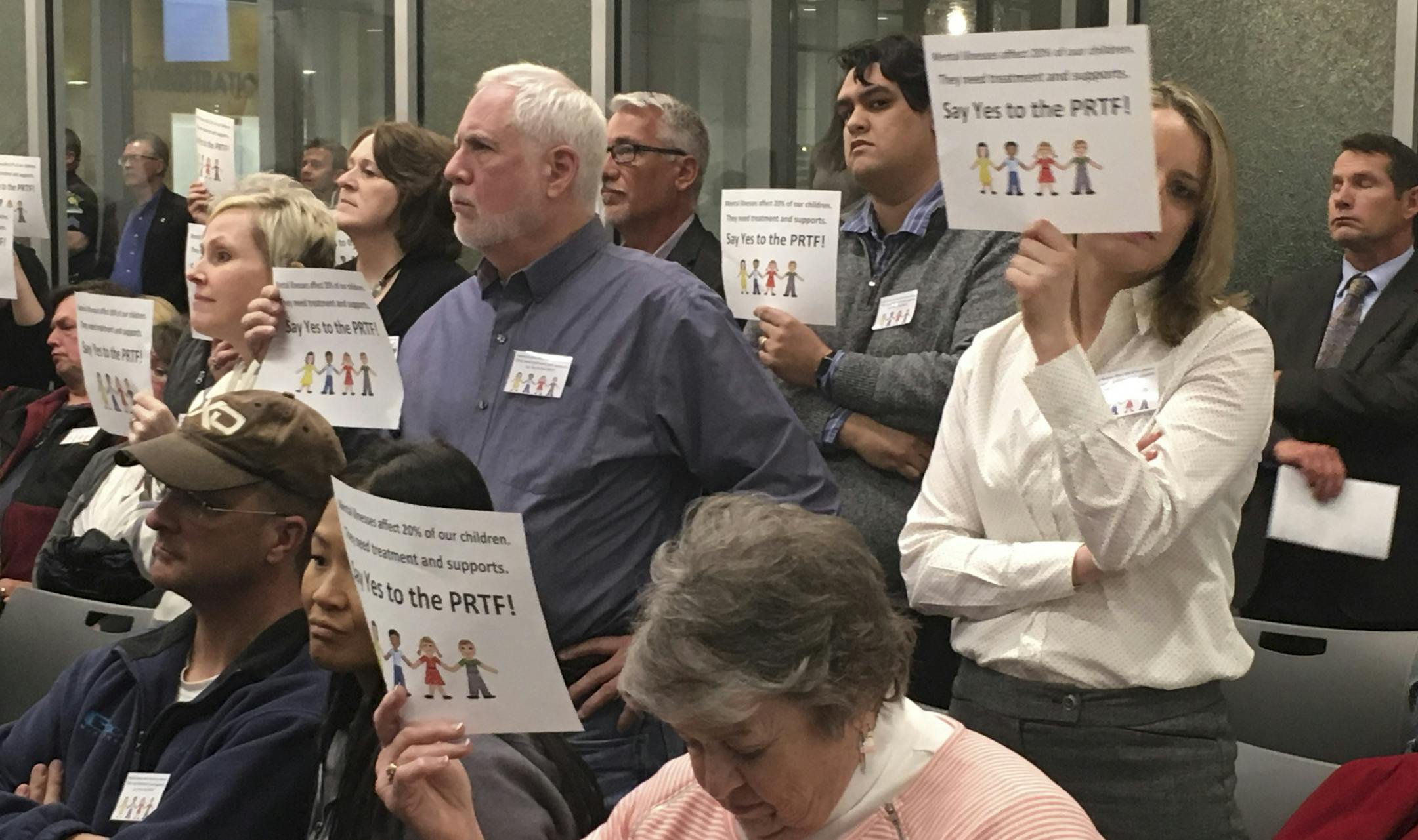 Angry residents of Forest Lake held up placards and some yelled, "Shame on you!" after city councilors voted to reject a psychiatric residential facility for children and adolescents.