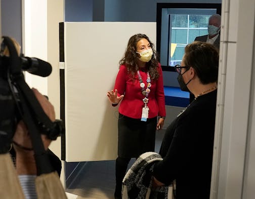 Dr. Gigi Chawla, chief of general pediatrics at Children's Minnesota, stood next to a breakaway door to a bathroom in a patient's room during a tour of a new Children's Minnesota inpatient mental health unit for children ages 6-18.