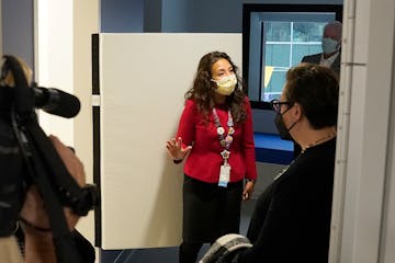 Dr. Gigi Chawla, chief of general pediatrics at Children's Minnesota, stood next to a breakaway door to a bathroom in a patient's room during a tour o