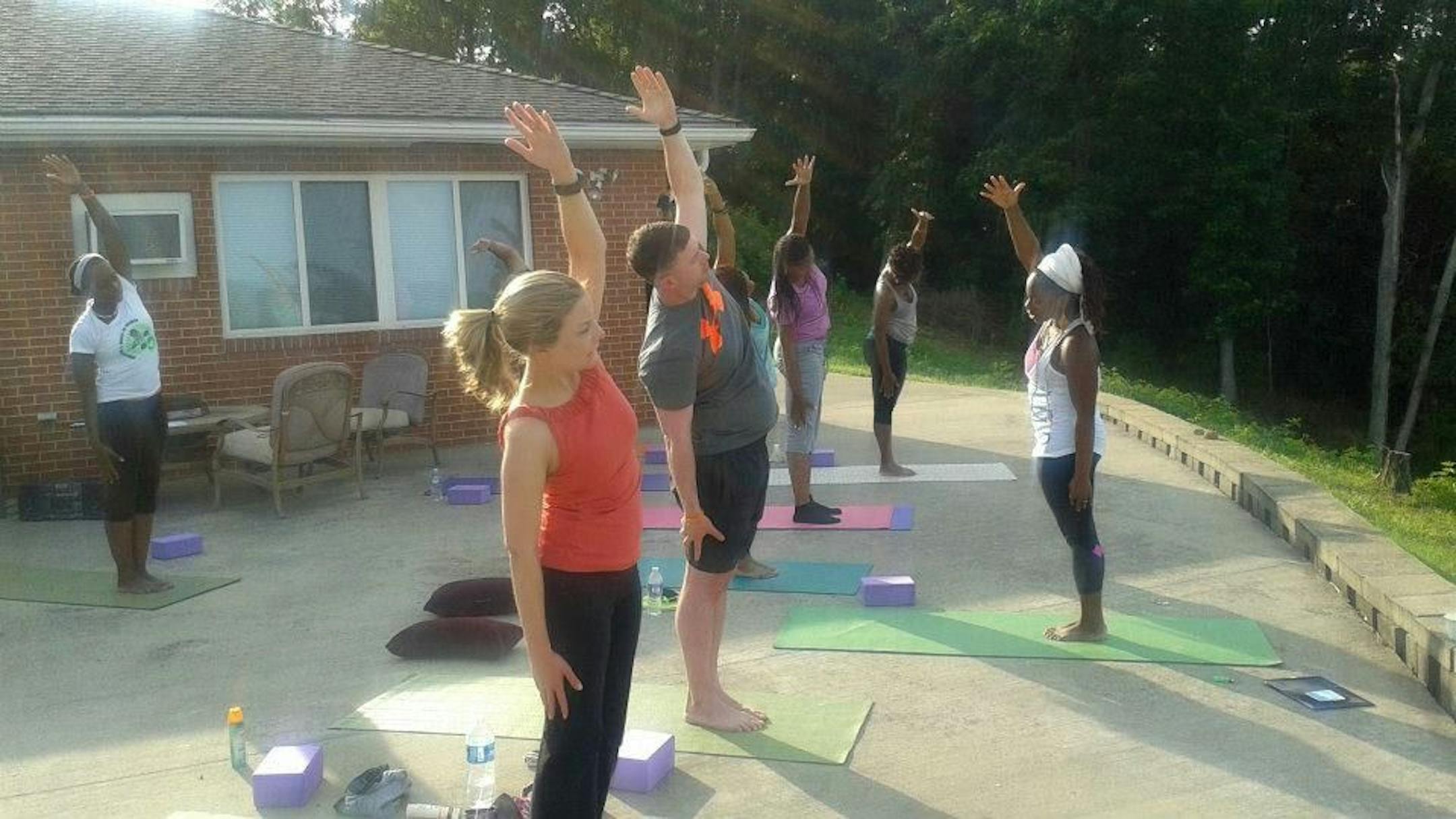 A morning class at Yogaville, in which even eyeballs get to stretch.
