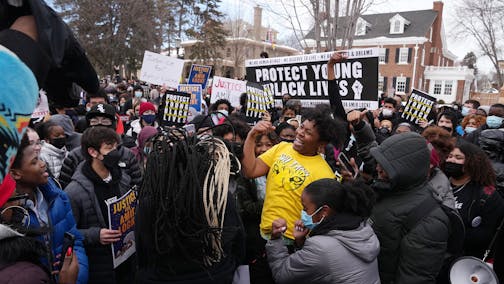 Students dance in the street on Summit Avenue in front of Gov. Tim Walz's residence after marching from St. Paul Central High School to protest the police killing of Amir Locke Tuesday, Feb. 8, 2022 in St. Paul, Minn. ] ANTHONY SOUFFLE • anthony.souffle@startribune.com