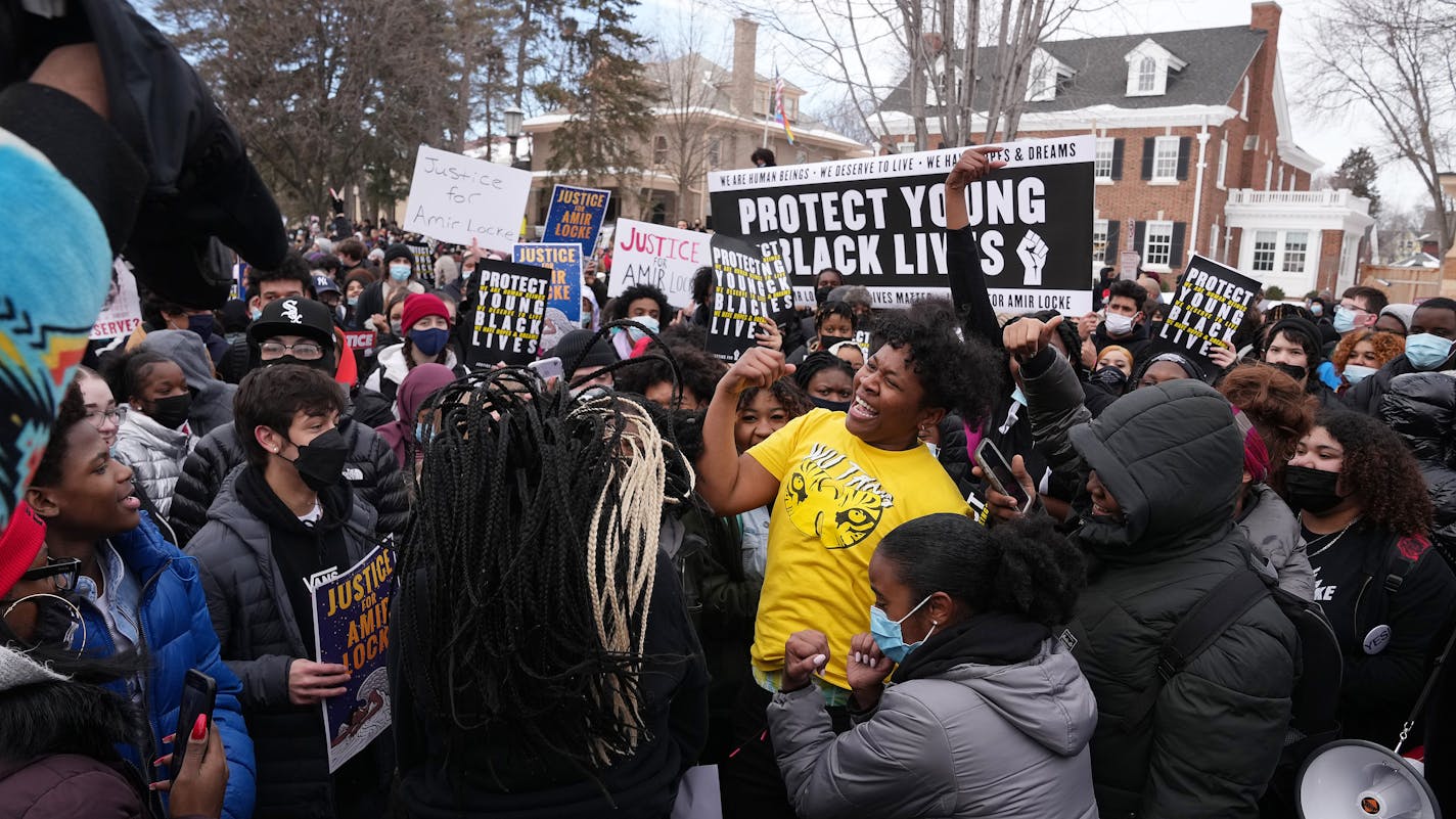 Students dance in the street on Summit Avenue in front of Gov. Tim Walz's residence after marching from St. Paul Central High School to protest the police killing of Amir Locke Tuesday, Feb. 8, 2022 in St. Paul, Minn. ] ANTHONY SOUFFLE • anthony.souffle@startribune.com