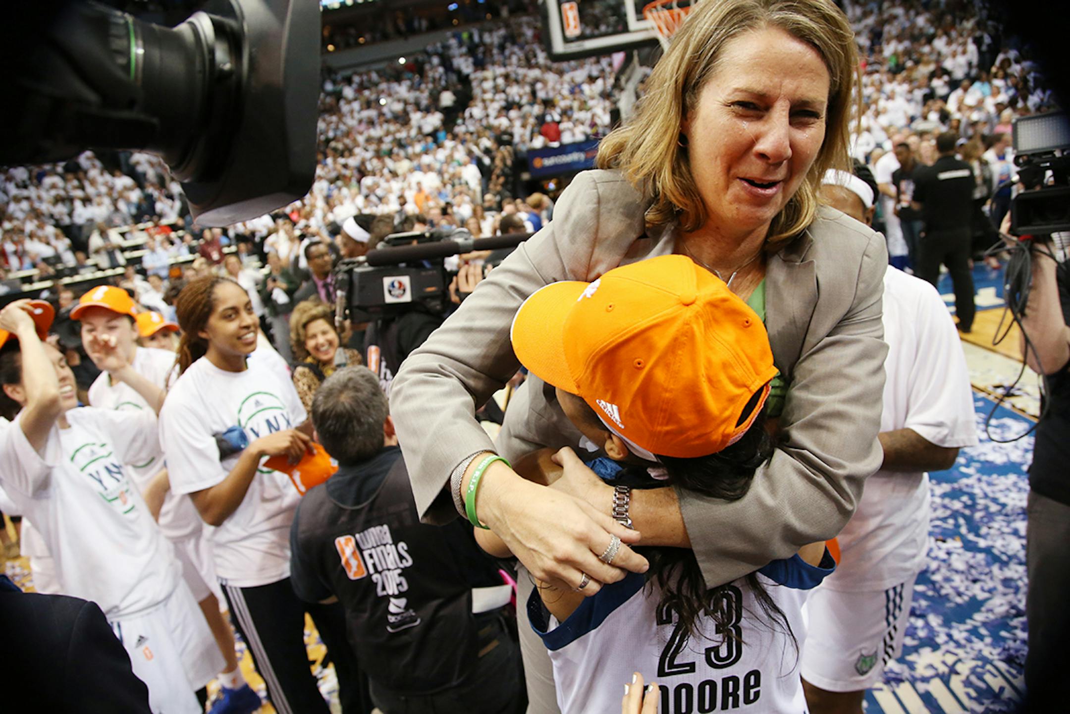 Minnesota Lynx head coach Cheryl Reeve celebrates winning the WNBA title with Minnesota Lynx forward Maya Moore (23).