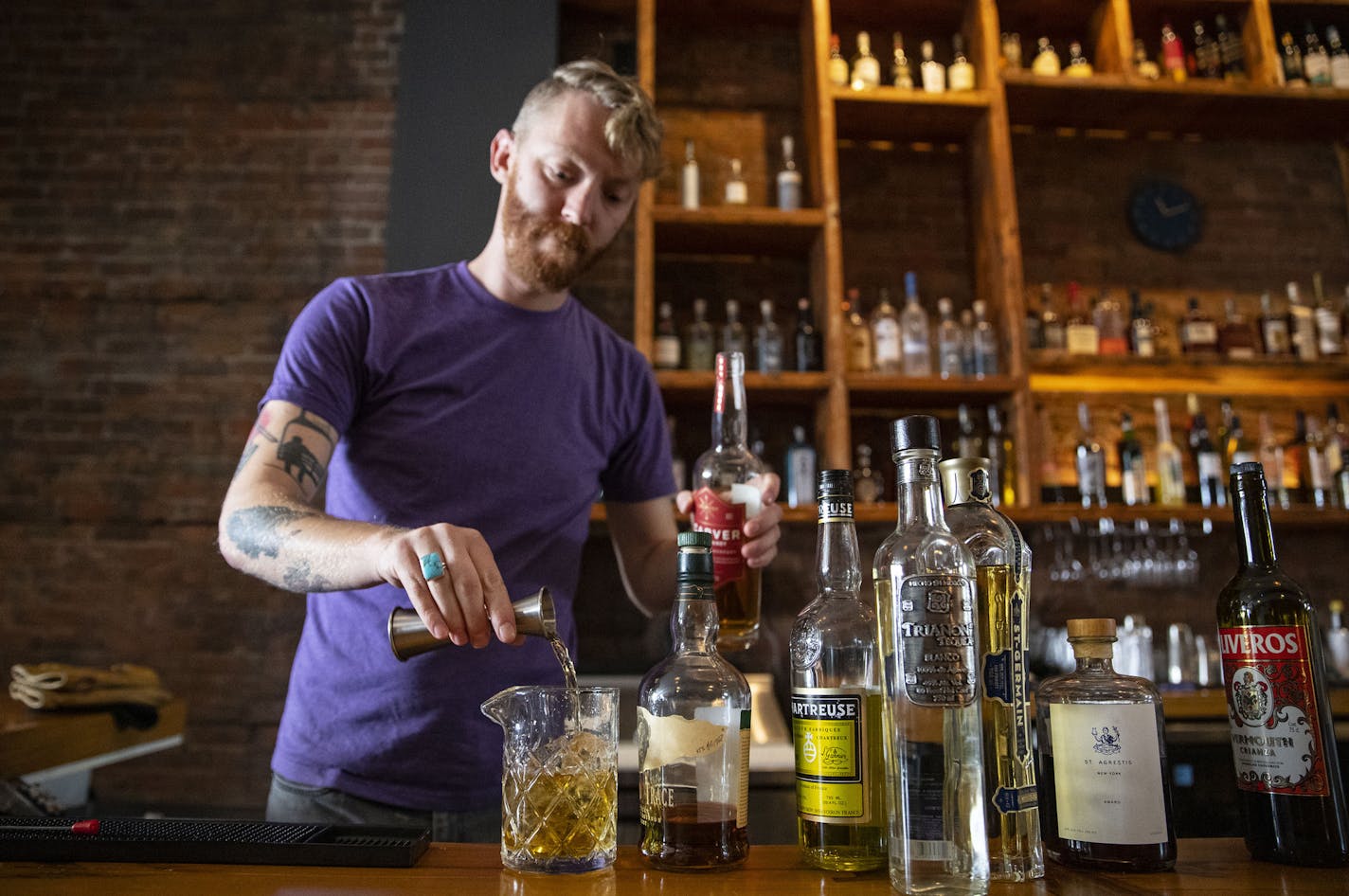 Noble Pour general manager Tyler Schwanke made one of their signature cocktails, Midnight Song, behind the bar on Thursday December 12, 2019. ]
ALEX KORMANN &#x2022; alex.kormann@startribune.com Noble Pour is a cocktail lounge opening in Duluth, MN on Sunday. It is the newest venture by Tom Hanson, the co-owner of OMC Smokehouse and Duluth Grill.