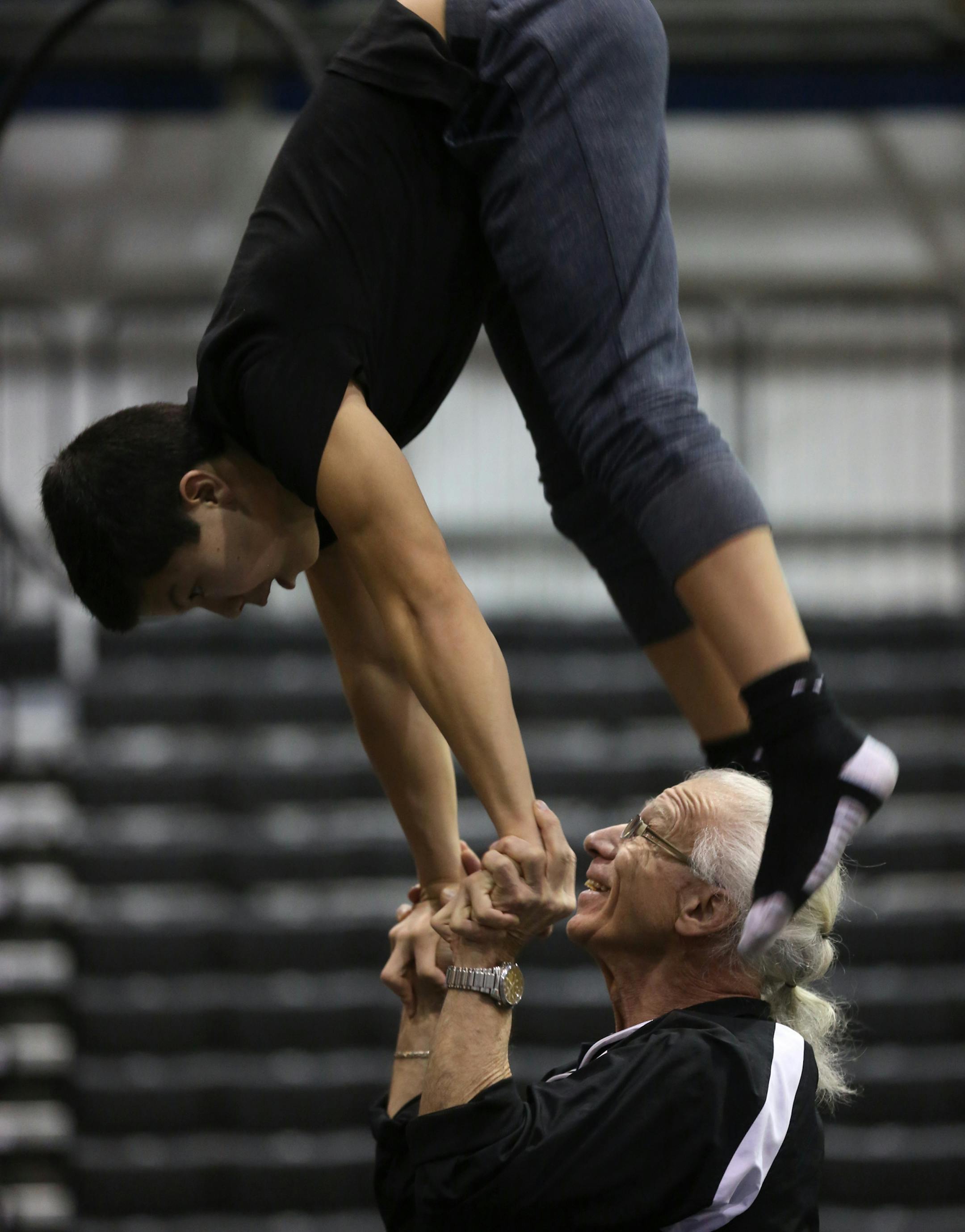 Circus Juventus coach Dmitrii Arnaoutov worked with Anwar Hassouni, 16, on hand to hand balancing as performers demonstrated their skills after a press conference. ] (KYNDELL HARKNESS/STAR TRIBUNE) kyndell.harkness@startribune.com Circus Juventus has been invited by The Smithsonian Institute to perform at the 50th anniversary Smithsonian Folklife Festival this summer. This was shot Friday, March 3, 2017 at Circus Juventus in St. Paul, Min.