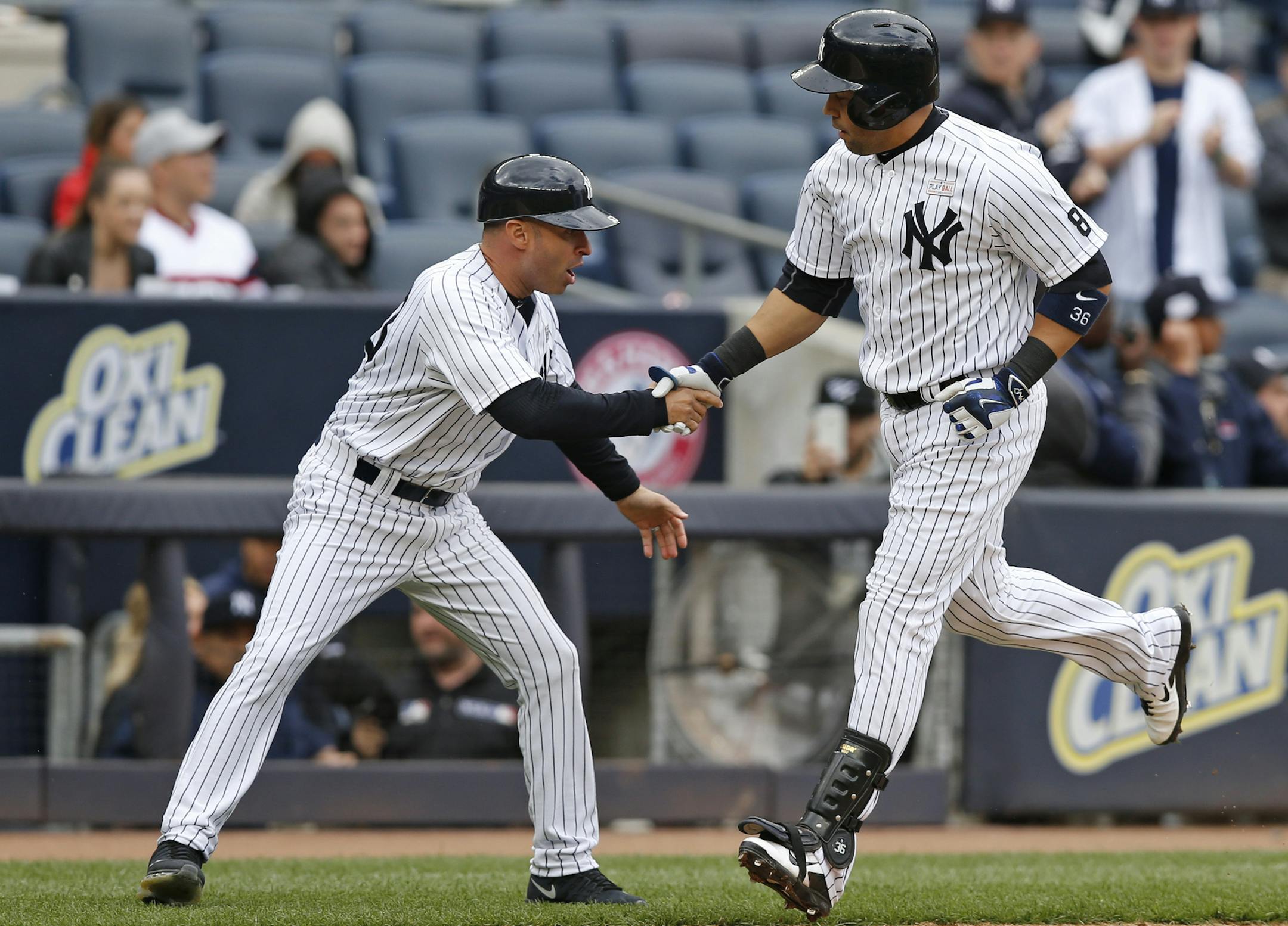 New York Yankees third-base coach Joe Espada greets the Yankees Carlos Beltran as he round third base after hitting a two-run, home run off Chicago White Sox Zach Duke in the sixth inning of a baseball game in New York, Sunday, May 15, 2016. Beltran became just the fourth switch-hitter to reach 400 homers after Mickey Mantle (536), Eddie Murray (504) and Chipper Jones (468). Heís also only the third Puerto Rico-born player to reach the milestone after Carlos Delgado (473) and Juan Gonzalez