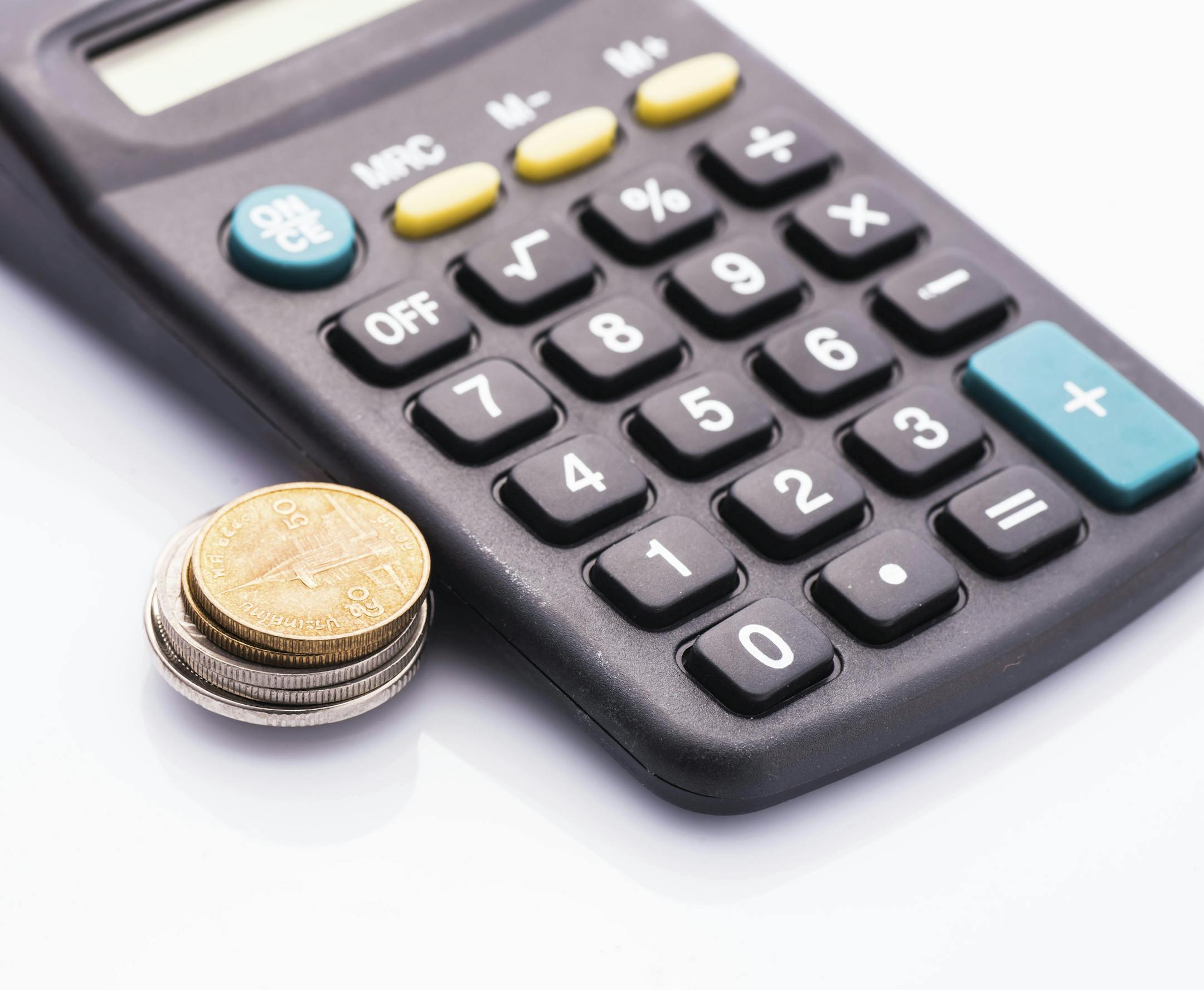 Thai coins and calculator isolated on white,money manage concept