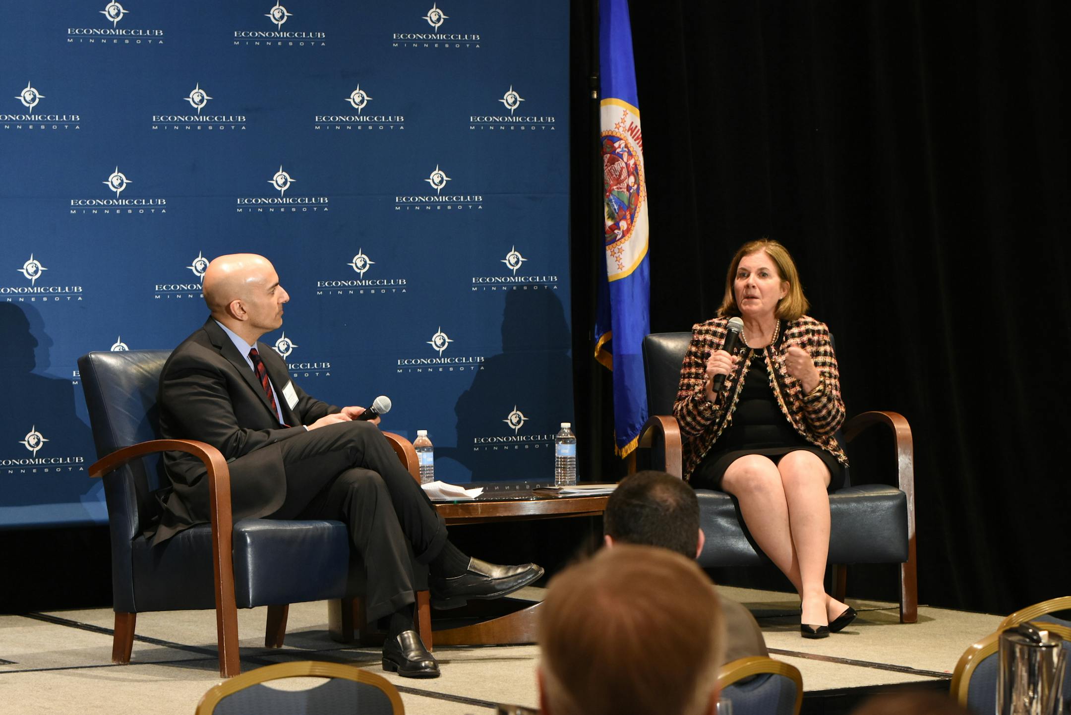 Neel Kashkari, left, president of the Federal Reserve Bank of Minneapolis, listens to Esther George, president of the Federal Reserve Bank of Kansas City, at an event hosted by the Economic Club of Minnesota in Minneapolis Tuesday. The two regional Fed leaders approach interest rate policy-setting from different perspectives.