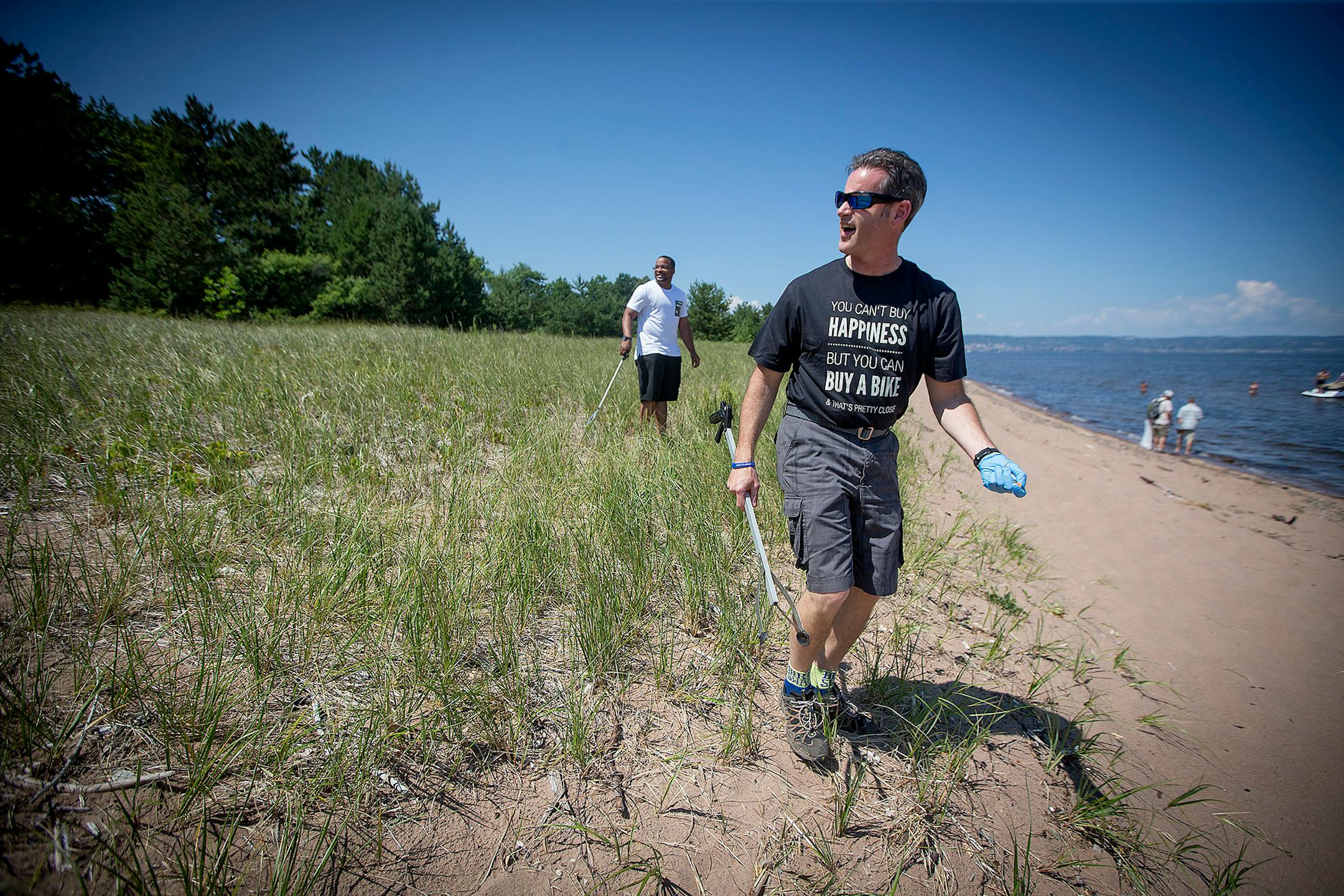 Duluth Judge Shaun Floerke cleaned Park Point beach with DWI defendants, Friday, July 28, 2017 in Duluth, MN.