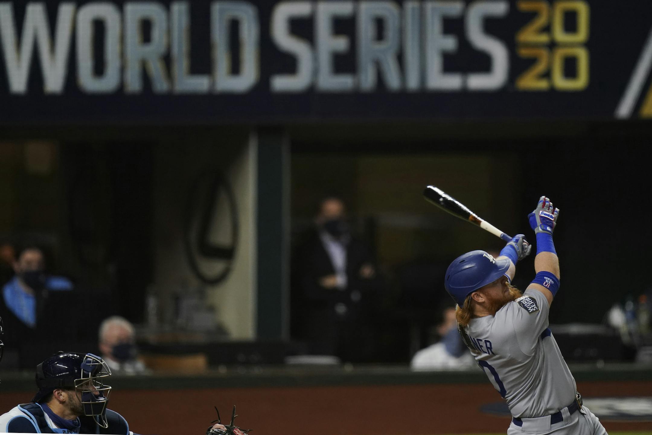Los Angeles Dodgers' Justin Turner watches his home run against the Tampa Bay Rays during the first inning in Game 3 of the baseball World Series Friday, Oct. 23, 2020, in Arlington, Texas. (AP Photo/Eric Gay)
