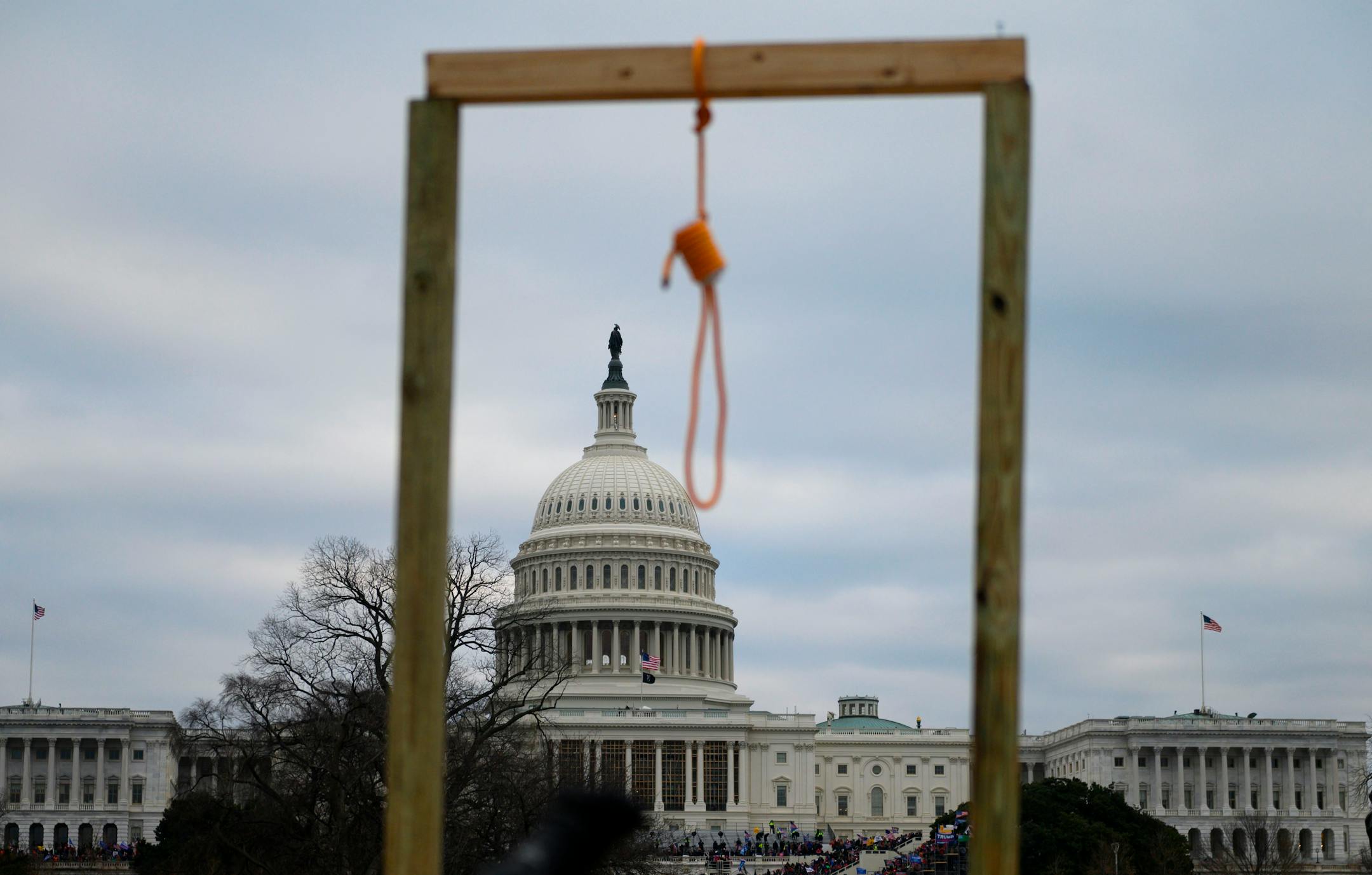 TOPSHOT - A noose is seen on makeshift gallows as supporters of US President Donald Trump gather on the West side of the US Capitol in Washington DC on January 6, 2021. - Donald Trump's supporters stormed a session of Congress held today, January 6, to certify Joe Biden's election win, triggering unprecedented chaos and violence at the heart of American democracy and accusations the president was attempting a coup. (Photo by Andrew CABALLERO-REYNOLDS / AFP) (Photo by ANDREW CABALLERO-REYNOLDS/AFP via Getty Images) ORG XMIT: 775604807