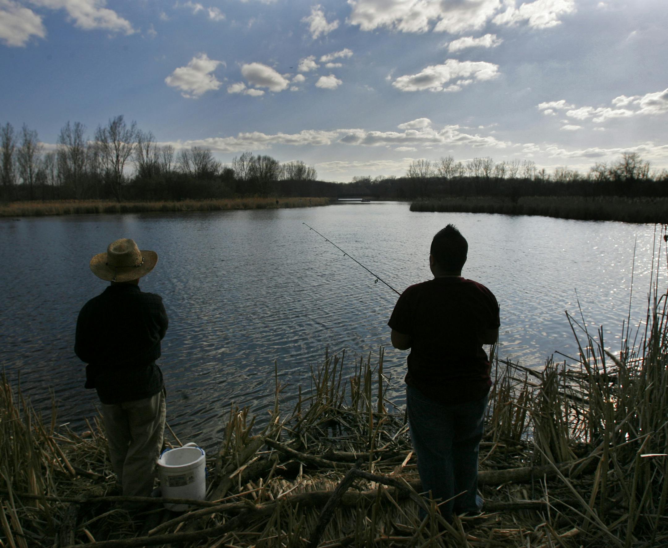 RENEE JONES SCHNEIDER ¬• reneejones@startribune.com Medicine Lake in Plymouth, MN - April 19, 2007 - Mao Lee, right, went fishing with her father Cher Cha Lee at Medicine Lake in Plymouth. Mao credits her love of fishing to her father taking her with him throughout the years. // See articles Sunday December 3, 2006, Star Tribune, page A1, and Sunday February 25, 2007, Star Tribune, page A1, and Sunday April 29, 2007, page A1. // Occasional series follows four high school students (To