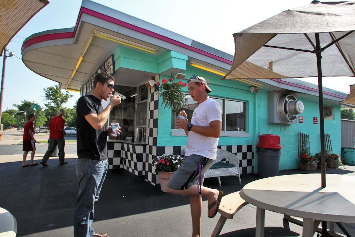 Dairy Delite is a seasonal ice cream / burgers / fries stand that operates in downtown Lakeville and serves as a destination point for summer fun. Drew Ostendorf, left, and Max Meehan, both of Lakeville ate ice cream treats outside the stand.