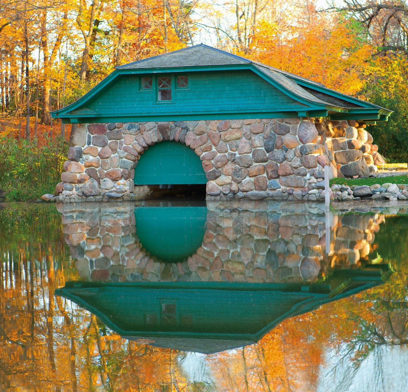 The 1906 Boulder Bridge stone boathouse is one of the few wet-slip style boathouses left on Lake Minnetonka.