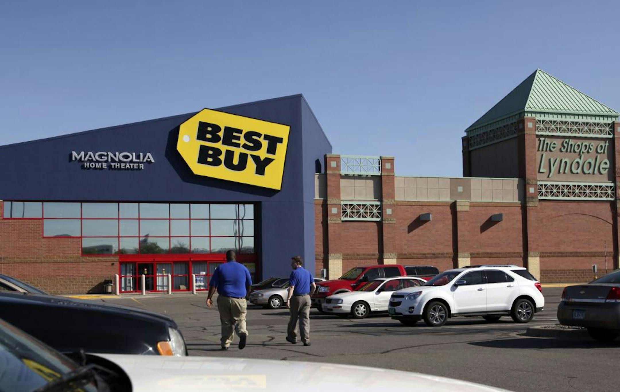 Best Buy employees walk through the parking lot and to the Best Buy store in the Shops of Lyndale in Richfield, MN, Thursday, March 28, 2012.