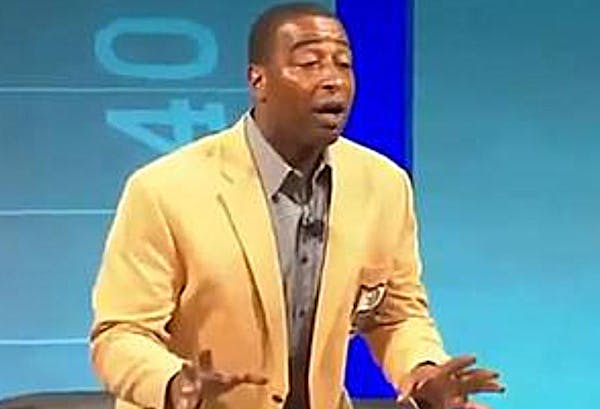 Cris Carter, in his Hall of Fame jacket, talks to rookies. "Fall guy" -gate. Stolen off web.