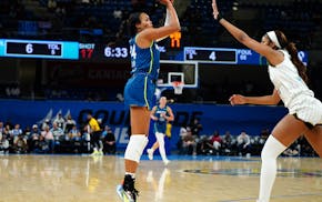 Lynx forward Napheesa Collier shoots over Sky forward Angel Reese during the first half of a preseason game Tuesday at Wintrust Arena in Chicago.