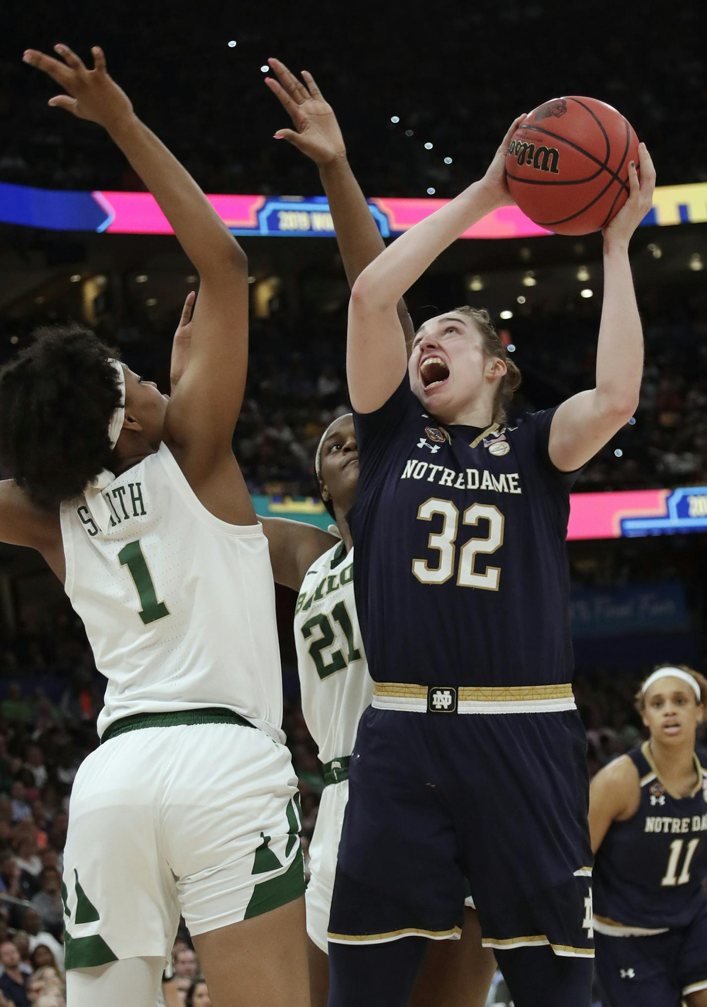 Notre Dame forward Jessica Shepard (32) drives to the basket as Baylor forward NaLyssa Smith (1) and center Kalani Brown (21) defend during the second half of the Final Four championship game of the NCAA women's college basketball tournament, Sunday, April 7, 2019, in Tampa, Fla. (AP Photo/John Raoux)