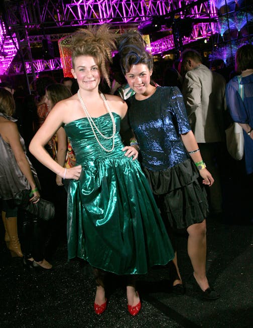 Jordan Anderson and Marisa Montelibano, college freshmen, from Eagan. Both are wearing vintage prom dresses from Everyday People and hair by "Do Hair" in Uptown. "We were in a vintage shop. These are the worst dresses we've seen so they're probably '80s," Anderson said. Relationship: Neighbors for 7 years. Anderson's most influential 1980s icon: "Michael Jackson and Prince. I listen to 'Purple Rain' during yoga." Montelibano's most influential 1980s icon: "I was born in the '90s. Sorry!"