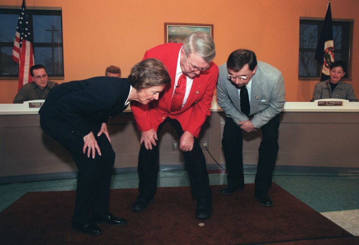 In 1998, a coin toss determined who would be the new mayor in Gilbert, Minn., after the election ended in a tie. Secretary of State Joan Grow, left, Gilbert Mayor Ed Schneider, center, and his opponent Karl Oberstar, right, bend down to examine a coin which Grow had just tossed to determine the winner of the Gilbert mayoral election, which resulted in a tie on election day. Oberstar won the toss.