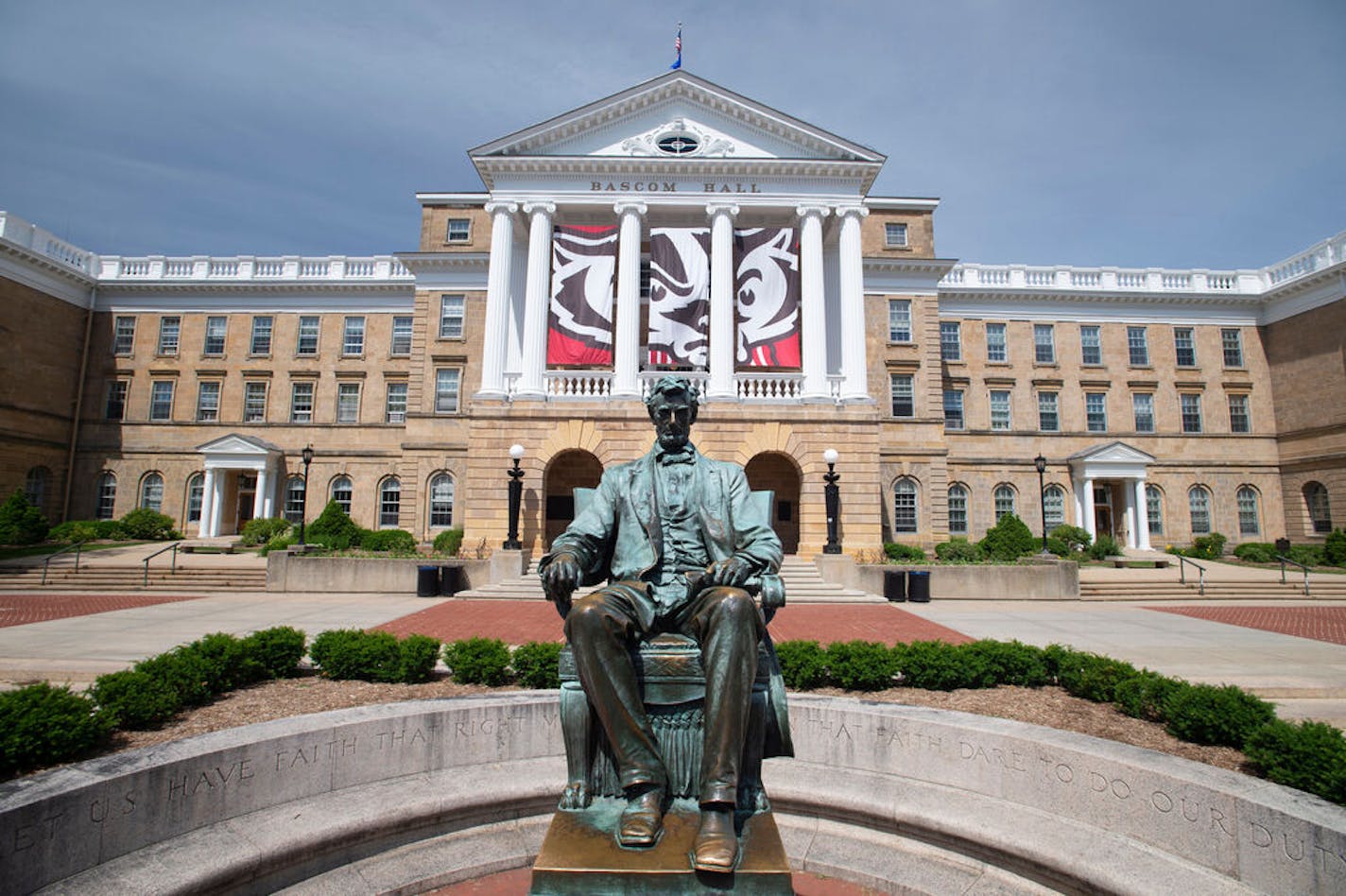 The Abraham Lincoln statue is pictured in front of Bascom Hall at the University of Wisconsin-Madison during spring on June 8, 2016. Hanging between the building's columns is a banner with a graphic of UW-Madison mascot Bucky Badger's face. ORG XMIT: MIN1903181605331315