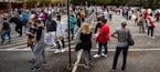 FILE - In this Oct. 12, 2020, file photo, hundreds of people wait in line for early voting in Marietta, Ga. Black people are going to the polls by the